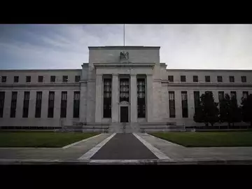 Fed Holds Rates Steady, Forecasts Series of Cuts in 2024