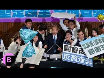 Taiwan Passes Bill as Lawmakers Throw Garbage Bags in Protest