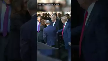 Donald Trump and Kamala Harris shake hands at Ground Zero