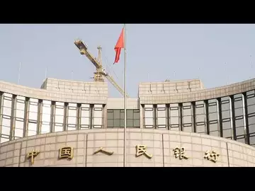 China's Central Bank Cuts Key Rate as Economic Data Disappoint